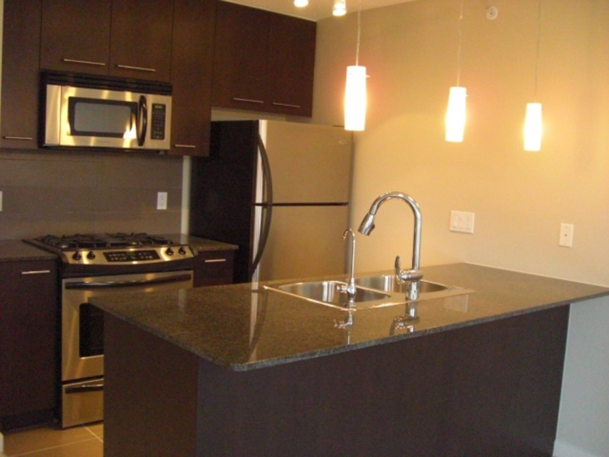 Kitchen at 1002 - 2979 Glen Dr, Coquitlam Center, Coquitlam